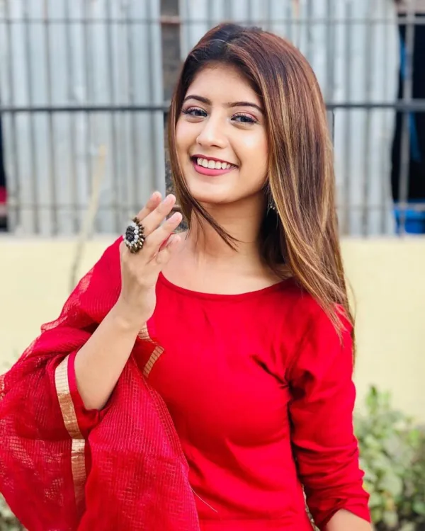Arishfa Khan — Arishfa Khan — a smile in red.